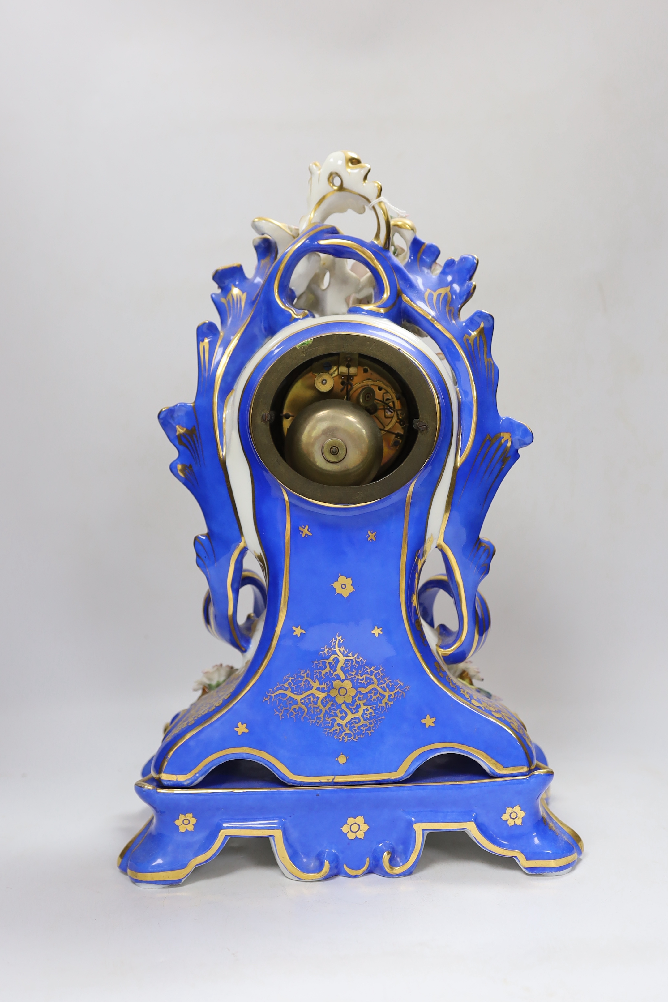 Henri Marc of Paris, a mid 19th century floral encrusted and painted balloon shaped eight day mantel clock, striking on a bell, with key, 42cm